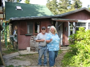 Archie and Hilloah in front of cabin